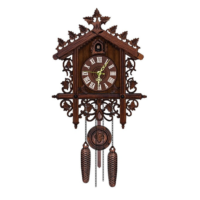 Orologio a cucù in legno intagliato
