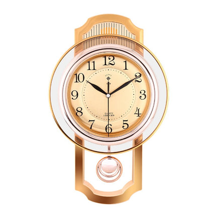 Orologio a pendolo vintage finitura dorata