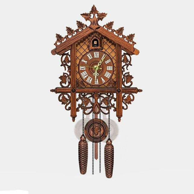 Orologio a cucù in legno intagliato