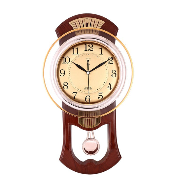 Orologio a pendolo vintage finitura dorata
