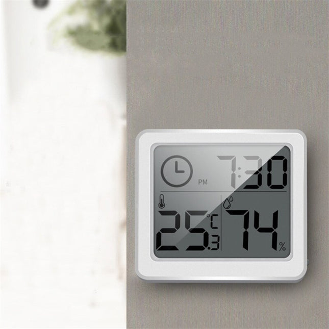 Orologio digitale da tavolo bianco con termometro