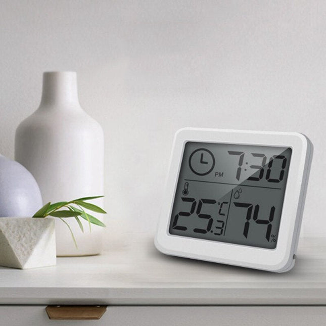 Orologio digitale da tavolo bianco con termometro
